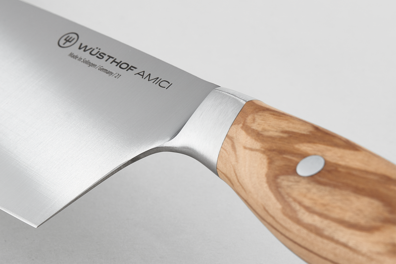 Wüsthof Amici 7 Santoku knife, featuring a sharp blade, ideal for precision cutting, displayed on a wooden surface, representative of Athens Cooks' quality kitchen tools.