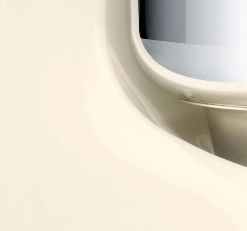 Close-up of Ankarsrum Stand Mixer's glossy edge, capturing its sleek design, ideal for tackling heavy doughs with its powerful motor and versatile accessories.