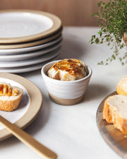 Farmhouse Pottery - Petite Silo Bowl: Single, displaying roasted garlic in a white-and-stoneware ramekin, surrounded by sliced bread, a butter knife, and fresh thyme.