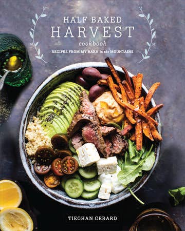 Cover of Half Baked Harvest Cookbook by Tieghan Gerard, featuring a rustic grain bowl with diverse ingredients, reflecting creative, farm-to-table recipes.