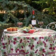 Couleur Nature - Squirrel and Pinecone Red & Brown Tablecloth on a garden table with wine, pastries, and pine centerpiece, showcasing French countryside charm.