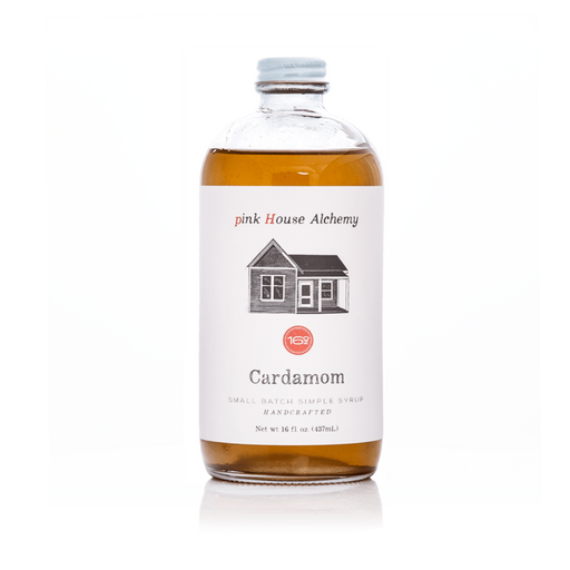 Pink House Alchemy - Cardamom Simple Syrup bottle with a white label, featuring a house image, perfect for enhancing coffee with its spicy and sweet floral notes.