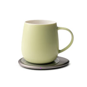 OHOM - Ui 3 Self-heating Mug Set: Jasmine White on an electric coaster, keeping beverages warm and wirelessly charging phones, ideal for kitchen enthusiasts.