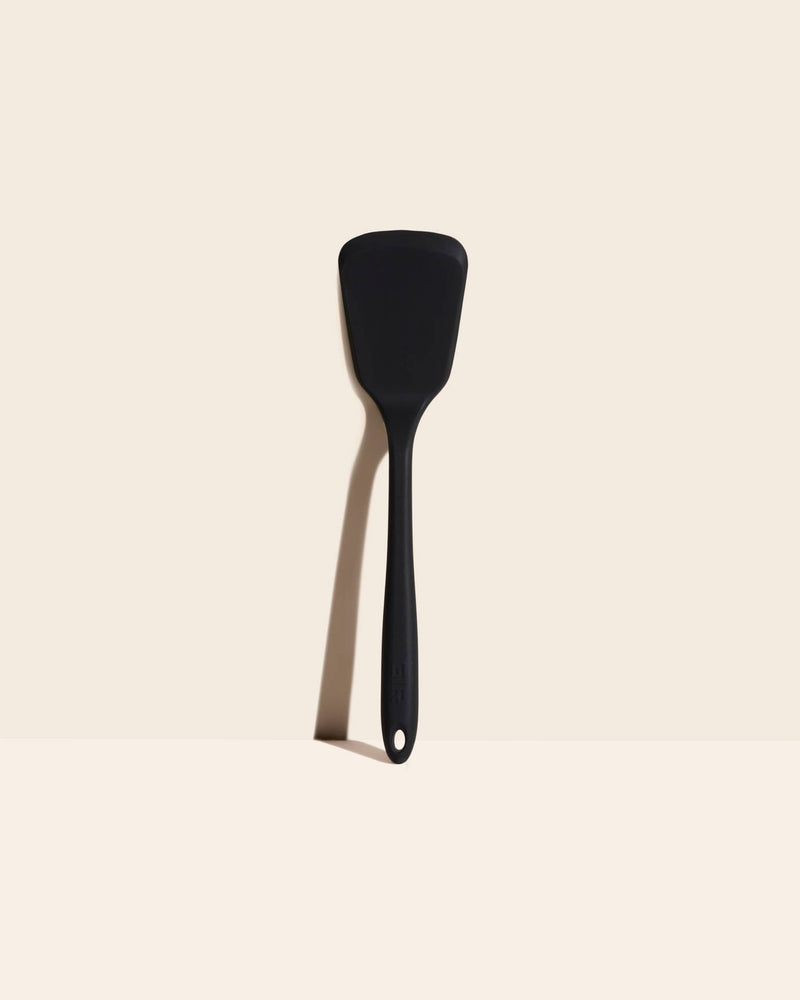 GIR | Ultimate Turner - Black: A versatile black spatula ideal for flipping and scraping, featuring a durable fiberglass core and flexible silicone edge for efficient cooking tasks.