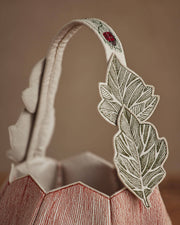 Coral & Tusk - Jack-o'-Lantern Basket features embroidered leaves and a vine-like handle, perfect for Halloween traditions.