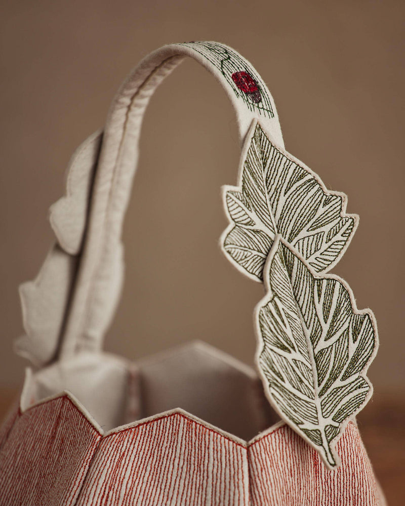 Coral & Tusk - Jack-o'-Lantern Basket features embroidered leaves and a vine-like handle, perfect for Halloween traditions.
