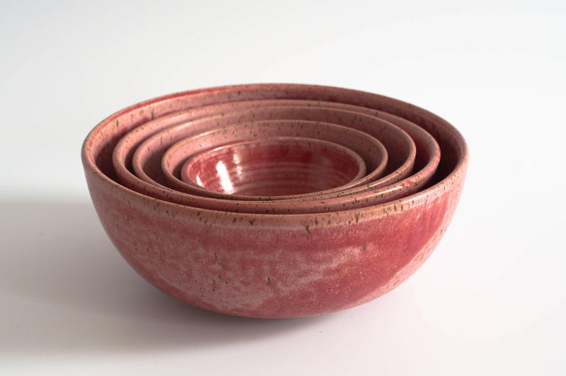 RachaelPots | Set of Three Nesting Bowls features hand-thrown, mottled reddish-pink ceramic bowls, perfect for food prep and serving, crafted in Brooklyn.