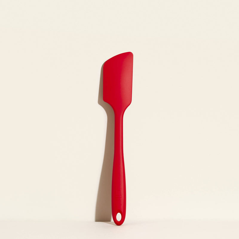 GIR Get It Right - GIR Ultimate Spatula: Sprinkles displayed on a white surface, showcasing its seamless design and flexible blade for versatile kitchen use.