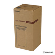 HARIO USA - HARIO Colors Glass Canister, 400ml: Amber, shown in its brown cardboard packaging, ideal for storing coffee beans or tea with a secure silicone seal.