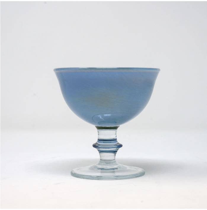 Arte Italica & Crown Linen Designs - Rialto Compote: Adriatic Blue, a mouth-blown glass with a clear base, showcasing intricate hand-painted swirls.