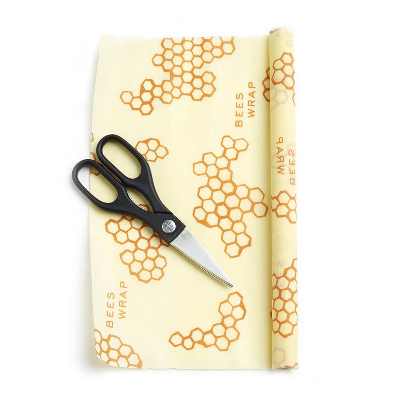 Bee's Wrap - Cut-to-Size Roll - Honeycomb with scissors on a surface, showcasing its customizable and eco-friendly food storage solution.