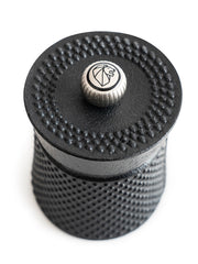 Peugeot | Bali Cast Iron Pepper Mill, Black, with hobnail finish and lion's-head logo knob, designed for a refined pepper ceremony experience.