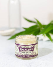 Roots And Leaves - Magnesium Body Butter in a jar, designed for topical magnesium absorption, offering relief for aches, muscle cramping, and restless legs.