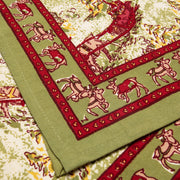 Couleur Nature - Renne Reindeer Red & Green Runner: 16 x 90, features stylized cows and heart accents, handprinted on linen, perfect for festive table settings.