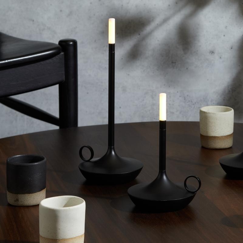 VANMOKUM | GRAYPANTS Wick Portable Rechargeable Lamp - Black, a sleek, cordless candle-like lamp, ideal for creating ambiance in kitchens or dining spaces.