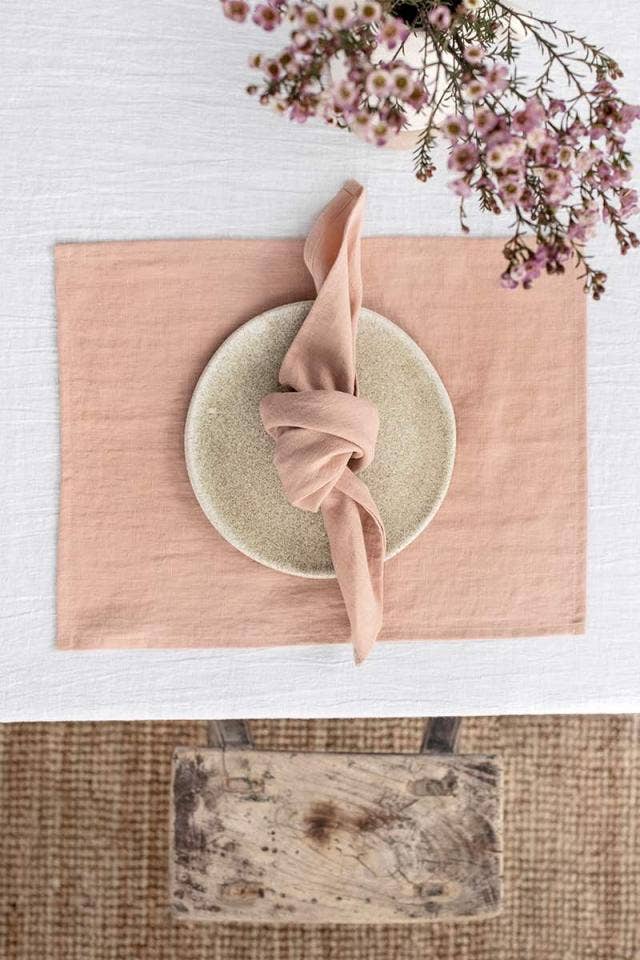 Set of 2 MagicLinen pure linen napkins on a plate, highlighting their premium quality and versatility for stylish table decor. Perfect for enhancing any dining setting.