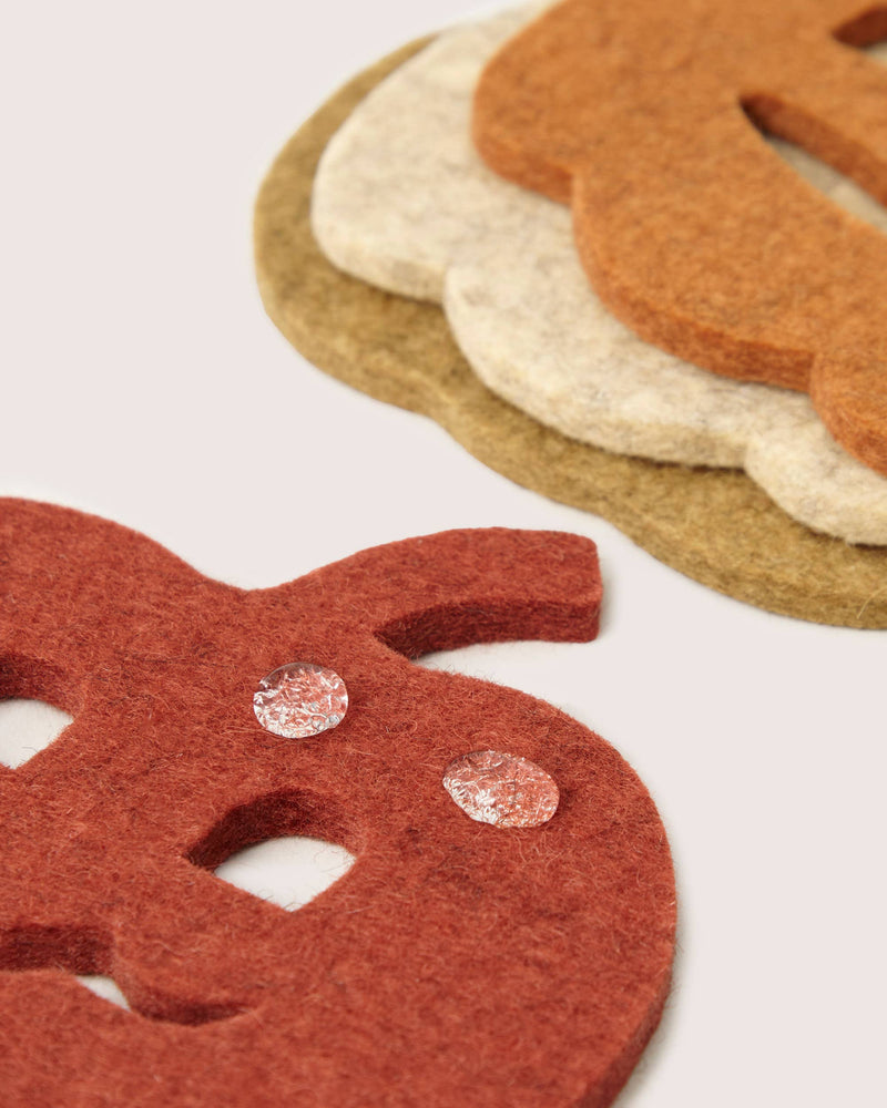 Graf Lantz - Merino Wool Pumpkin Coaster Multi 4 Pack showcasing water-resistant felt in autumnal designs, ideal for protecting surfaces with style and sustainability.