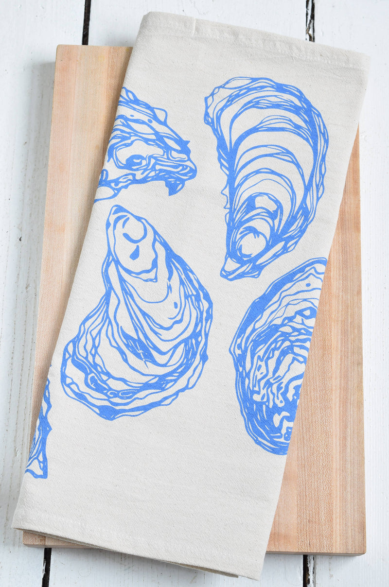 Hearth and Harrow - Oyster Tea Towel in Blue-violet, organic cotton, features a blue-violet oyster design, hand-printed on the bottom half, with a hanging loop.