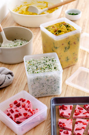 W&P - Freezer Cube Storage Containers: Set of 3 shown with various foods, highlighting their stackable, transparent design for organized freezer storage.