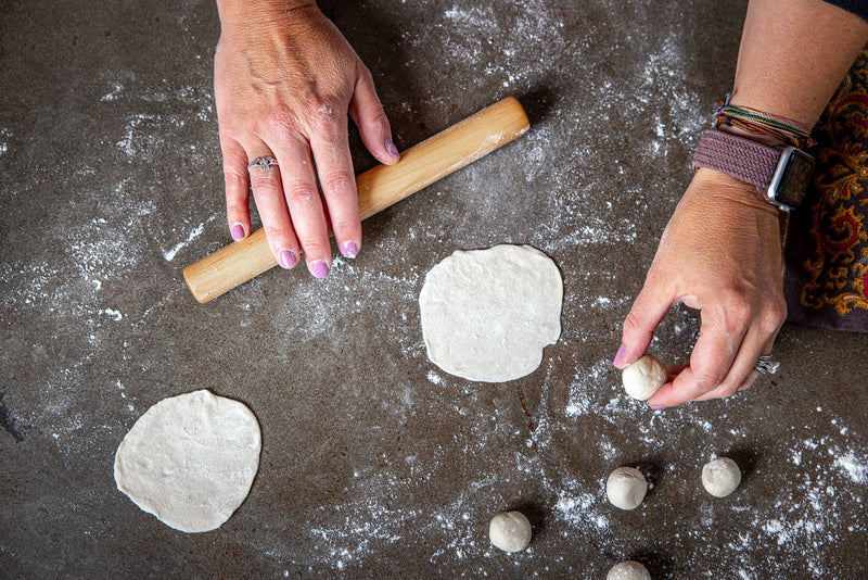Earlywood | Dumpling Pin - Jatoba, a compact wooden tool for rolling dough, ideal for dumplings and more, shown on a kitchen surface, suitable for all skill levels.