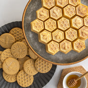 Nordic Ware | Honey Bees Cookie Stamps create detailed honey bee, flower, and honeycomb designs on cookies, ideal for bee-lovers and spring-themed baking.