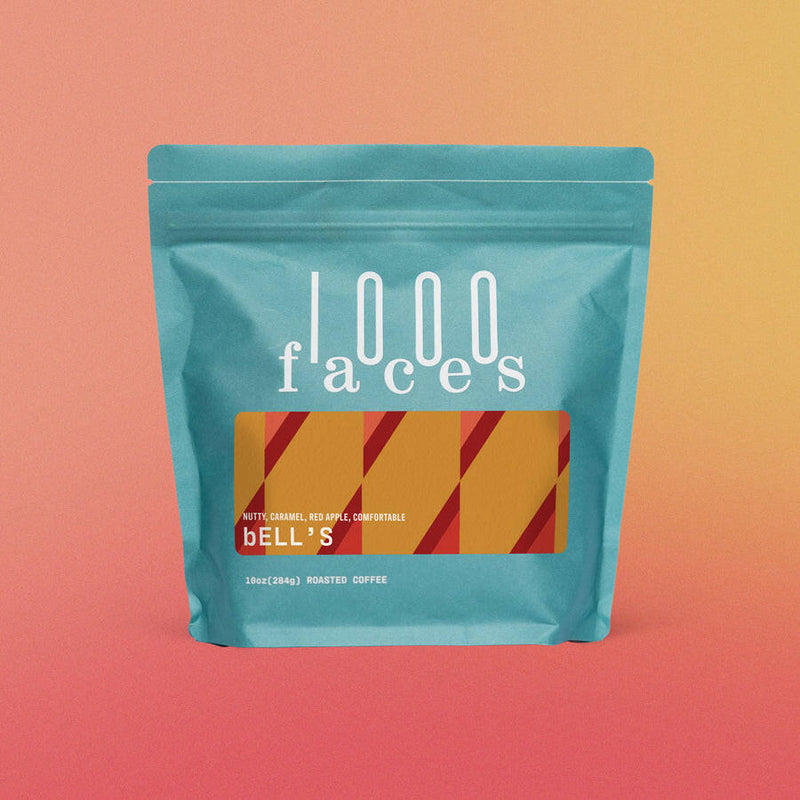 1000 Faces Coffee - Winter Solstice, 10 oz blue bag with red and yellow label, showcasing exceptional, sustainable coffee blends by Athens Cooks, Athens, Georgia.