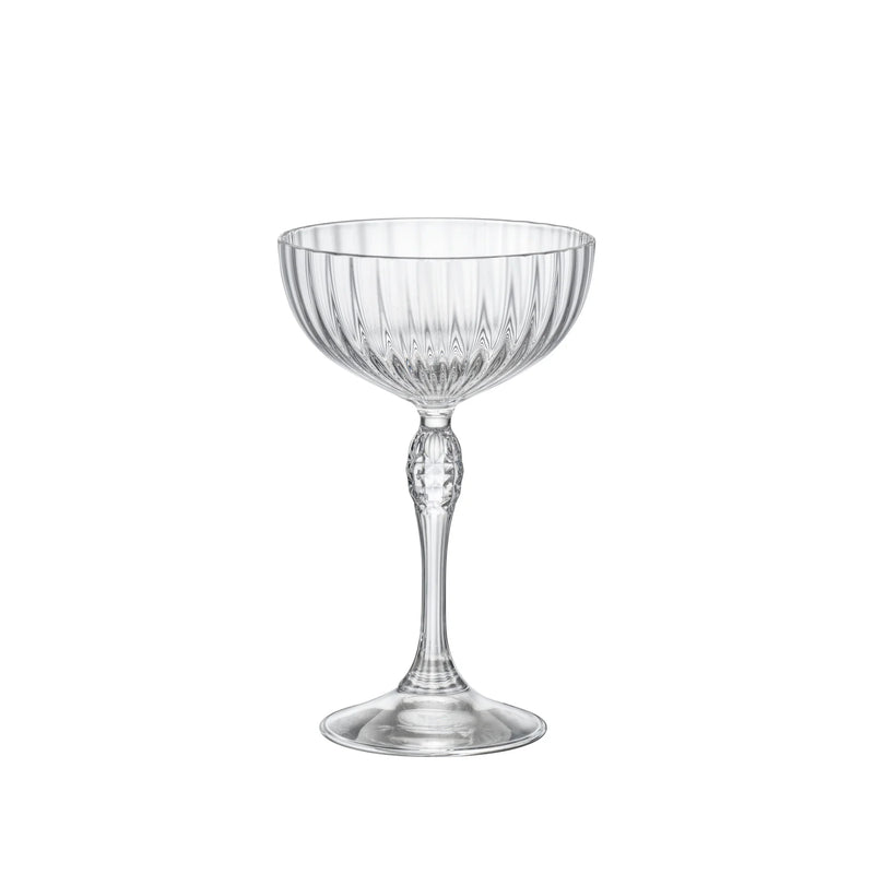 Bormioli | America's '20s Cocktail Coupe, 7.5 oz, Set of 4: Elegant stemmed glasses with fluted bowls and decorative stems, ideal for cocktails, reflecting Athens Cooks' curated barware selection.