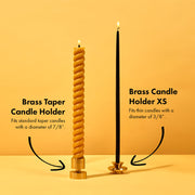 54 Celsius | Solid Brass Candle Holder with a black taper candle, showcasing its elegant, sturdy design. Perfect for standard 7/8 candles.