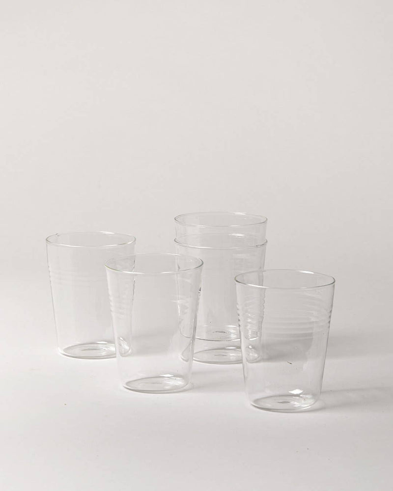 Farmhouse Pottery - Farmhouse Glasses: Set of 6 - Large, featuring five clear, borosilicate glass cups, ideal for luxurious everyday use, displayed in a minimalist style.