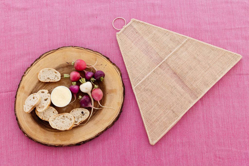 Handmade collapsible woven food tent in a unique pentagon shape, ideal for outdoor dining. Crafted from Abaca fiber, supports Filipino artisans.
