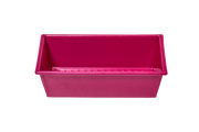 Great Jones | Breadwinner - Raspberry: A pink 1-lb loaf pan with a wavy, corrugated surface for nonstick baking, oven-safe and dishwasher-friendly.