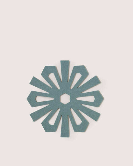Graf Lantz - Merino Wool Snowflake Trivet - Heather Spruce, a teal felt trivet with a petal design, protects surfaces while adding elegance to your kitchen decor.