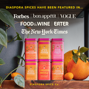 Diaspora Spices Co. Hot Cocoa Mix with Anamalai Cacao, showcased with spice tins, leafy vines, and citrus fruits, highlighted by major publication logos.