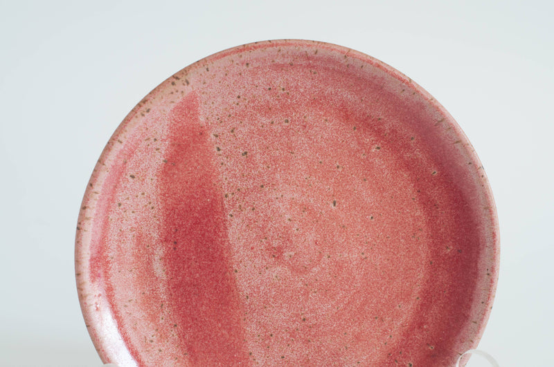 RachaelPots - Breakfast Bowl: Sage, a round, red-glazed ceramic plate with a speckled surface, ideal for versatile use in the kitchen, hand-thrown in Brooklyn.