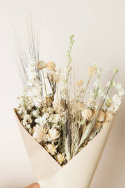 Idlewild Floral Co. - Sage Small Field Bouquet: A hand-held arrangement of dried flowers and grasses, featuring wheat, strawflowers, and filler blooms, wrapped in neutral-tone paper.