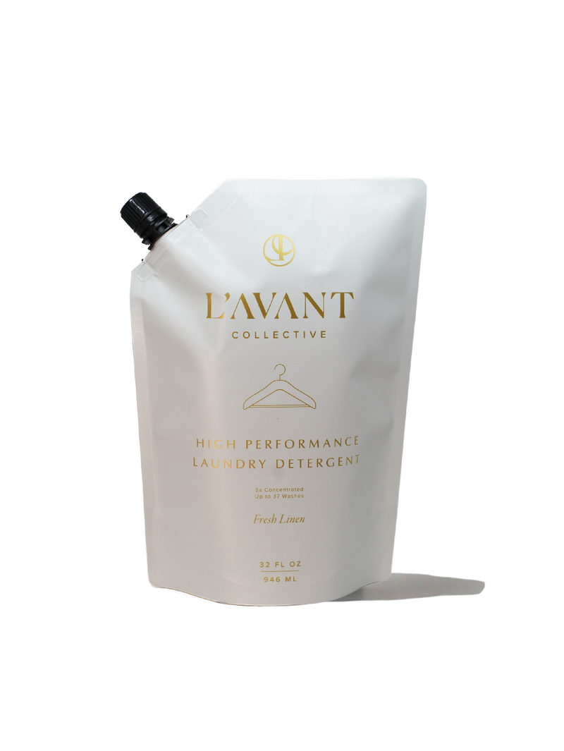 L'AVANT Collective - 32oz Laundry Detergent Refill - Fresh Linen, in a white pouch with a black cap, gold lettering, eco-friendly, concentrated formula.