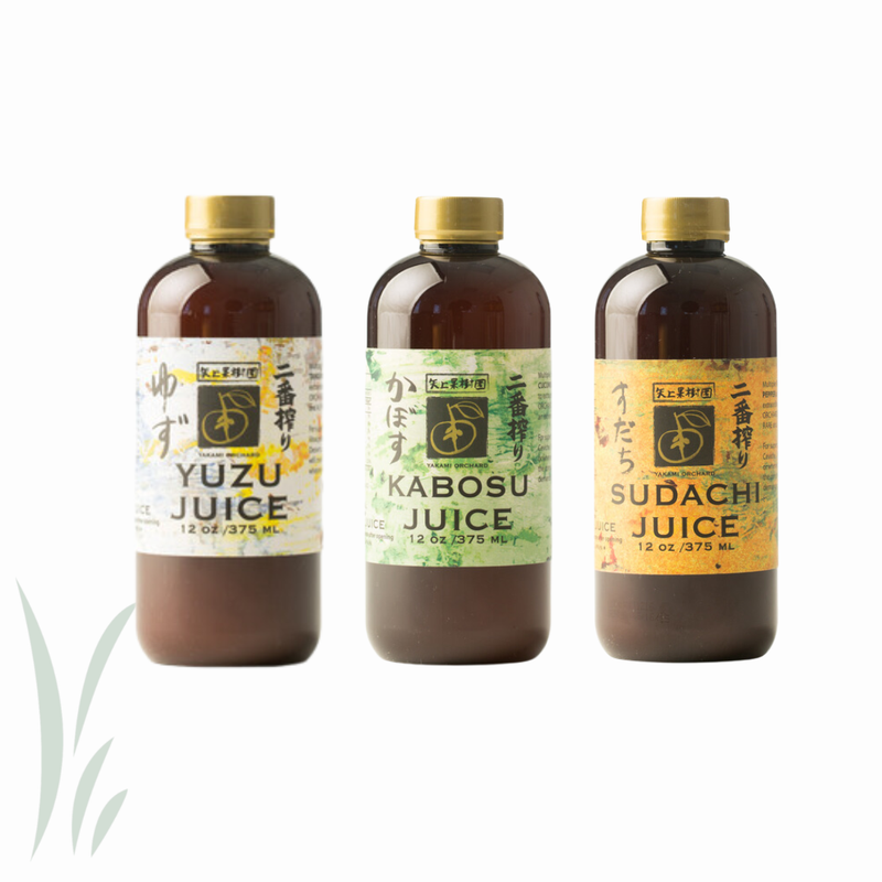Three 12 oz brown bottles from Yakami Orchard featuring Japanese citrus juices: Yuzu, Kabosu, and Sudachi, ideal for culinary and cocktail uses.