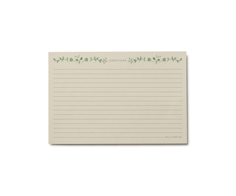 Pack of 12 Artichoke Recipe Cards by Rifle Paper Co., featuring a lined cream sheet with green floral border, perfect for organizing recipes in a tin.