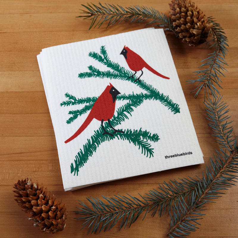 Three Bluebirds Swedish Dishcloth featuring cardinals on a bird-themed napkin, showcasing eco-friendly, reusable design ideal for kitchen cleaning tasks.