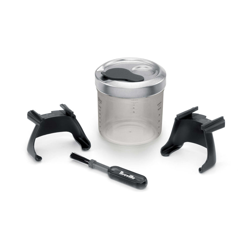 Breville Smart Grinder Pro accessory set, including portafilter stands, graduated container, and cleaning brush, complements coffee grinding precision. Ideal for espresso enthusiasts at Athens Cooks.