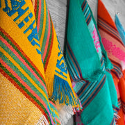 Servilletas | Set of 4 Mexican Napkin: A variety of vibrant, patterned textiles, showcasing traditional Mexican weaving, ideal for enhancing kitchen decor and dining experiences.