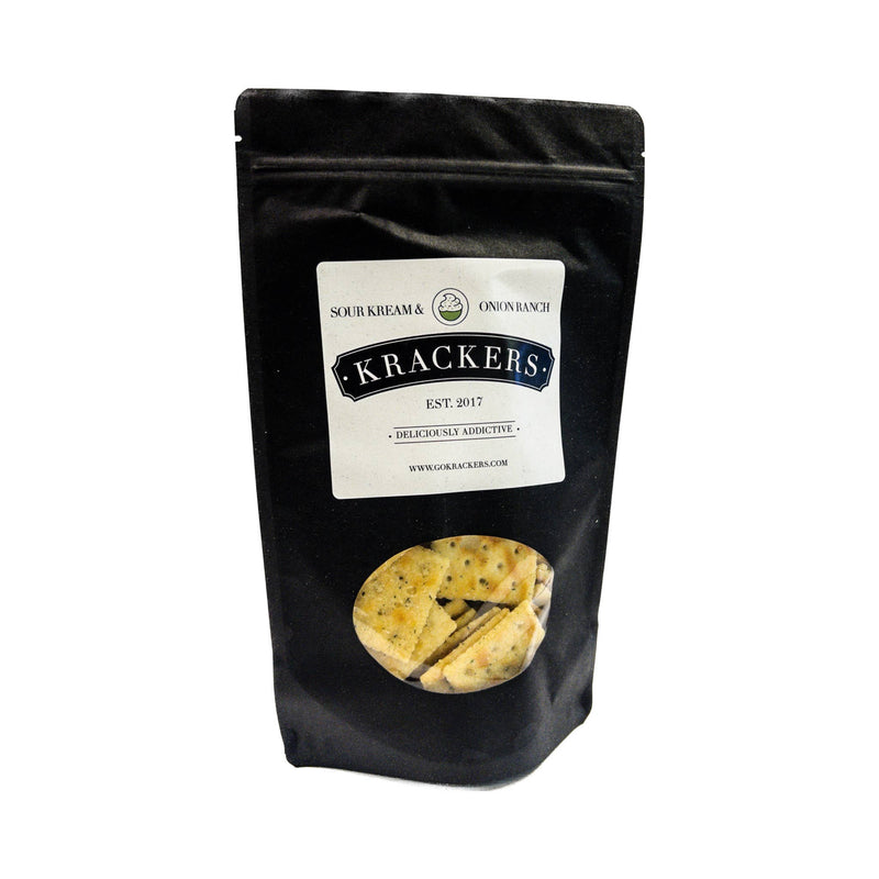 Krackers | Sour Kream and Onion Ranch: A black bag of spicy ranch-flavored crackers with a visible white label, perfect for adventurous snack enthusiasts.