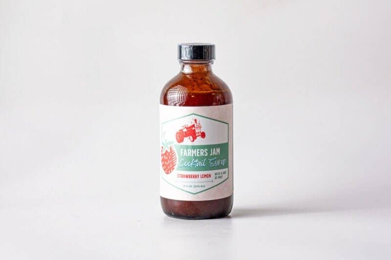 Farmers Jam Strawberry Lemonade Cocktail Syrup, 8oz amber-glass bottle, ideal for cocktails or mocktails, featuring organic ingredients from Georgia and South Carolina farms.