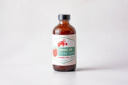 Farmers Jam | Strawberry Lemonade Cocktail Syrup - 8oz bottle with a red tractor and strawberry label, ideal for cocktails, supporting local farms.