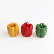 Artifaqt - Bell Pepper Beeswax Candle: Red, crafted from Swarmbustin’ Honey beeswax, shaped like a red bell pepper, offering a 30-hour burn time.