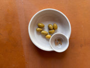 ROB Ceramics - Olive Serving Bowl Handmade: White, featuring a dual-section design with olives and pits, ideal for charcuterie boards and tidy entertaining.