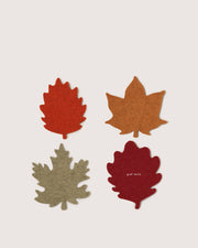 Graf Lantz - Merino Wool Autumn Leaf Coaster Multi 4 Pack, showcasing four felt leaf coasters in autumn hues, arranged neatly, embodying seasonal elegance and practical home decor.