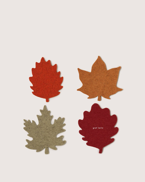 Graf Lantz - Merino Wool Autumn Leaf Coaster Multi 4 Pack, showcasing four felt leaf coasters in autumn hues, arranged neatly, embodying seasonal elegance and practical home decor.