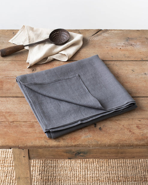MagicLinen's elegant linen tablecloth, 59 x 98 inches, with a simple seam finish, ideal for enhancing dining settings.
