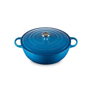 Le Creuset | Signature Chef's Ovens: A round, blue enameled cast-iron Dutch oven with sloped sides, metal knob, and large loop handles for versatile cooking tasks.